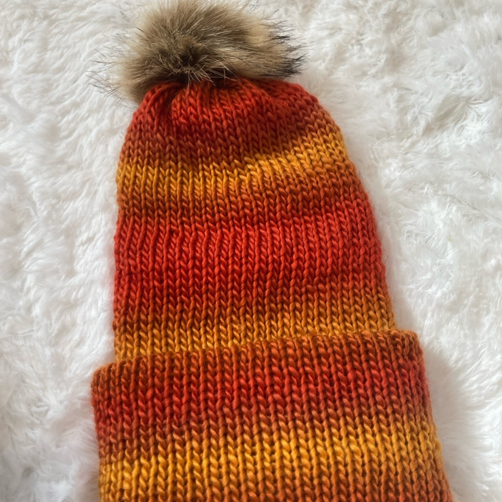 Vibrant shades of orange,yellow,red. reversible hat w/ removable Pompom. unisex